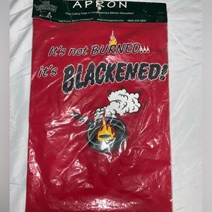 The Imagination Association Apron "It's Not Burned It's Blackened"